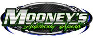 Logo for Mooney’s Autobody Experts featuring stylized white text on a black, metallic-textured oval background.