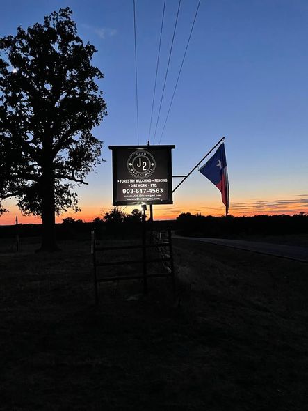 A sunset with a sign that says ' texas ' on it