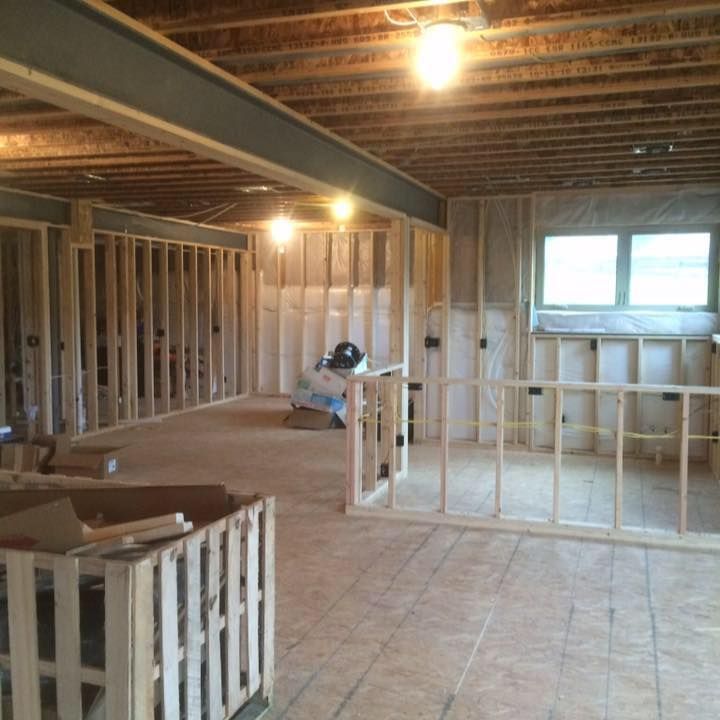 A room that is being built with a lot of wood
