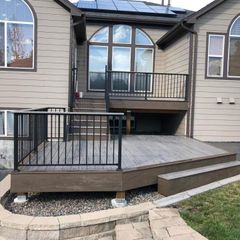The back of a house with a deck and stairs