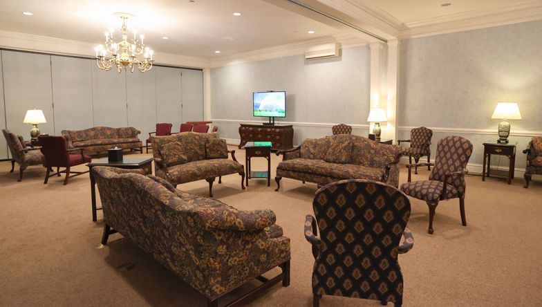 A living room filled with furniture and a television