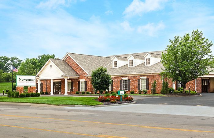 A large brick building with a sign that says ' signature ' on it