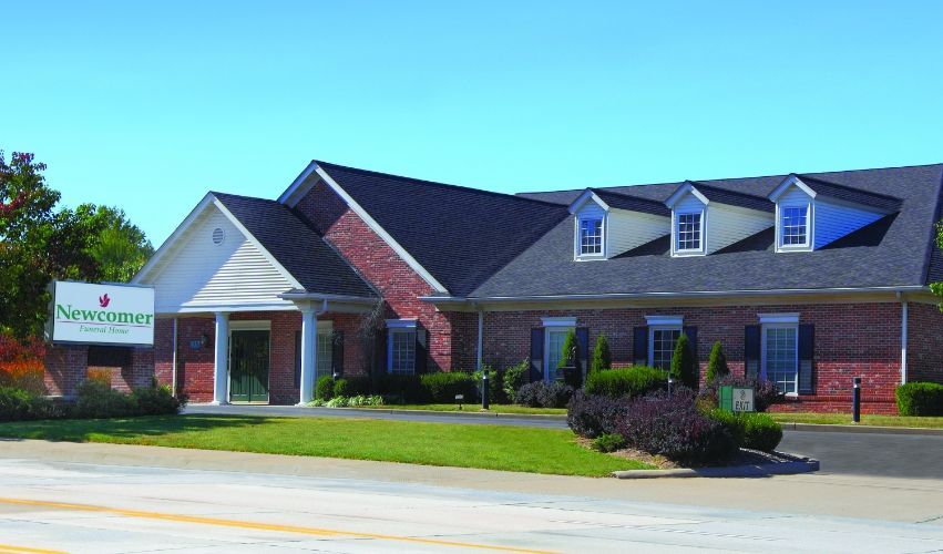 A large brick building with a sign that says ' signature ' on it