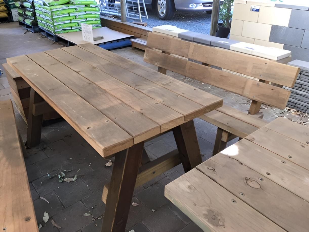 A Wooden Table and Benches Are in A Store — Gnomes Landscape & Garden Supplies In Taree South, NSW
