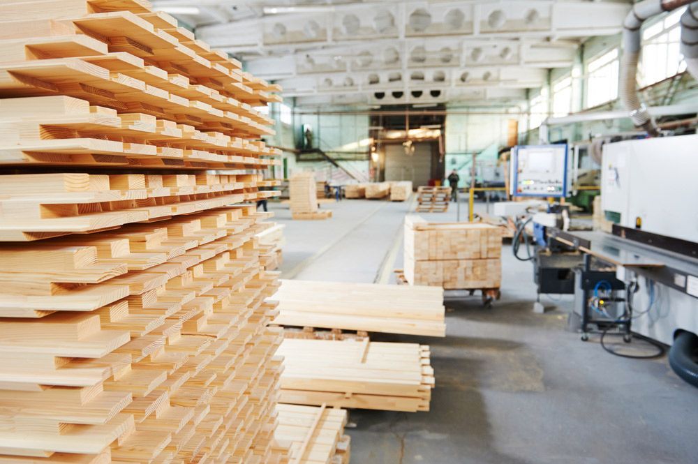A Warehouse Filled with Lots of Wooden Boards — Gnomes Landscape & Garden Supplies In Hallidays Point, NSW