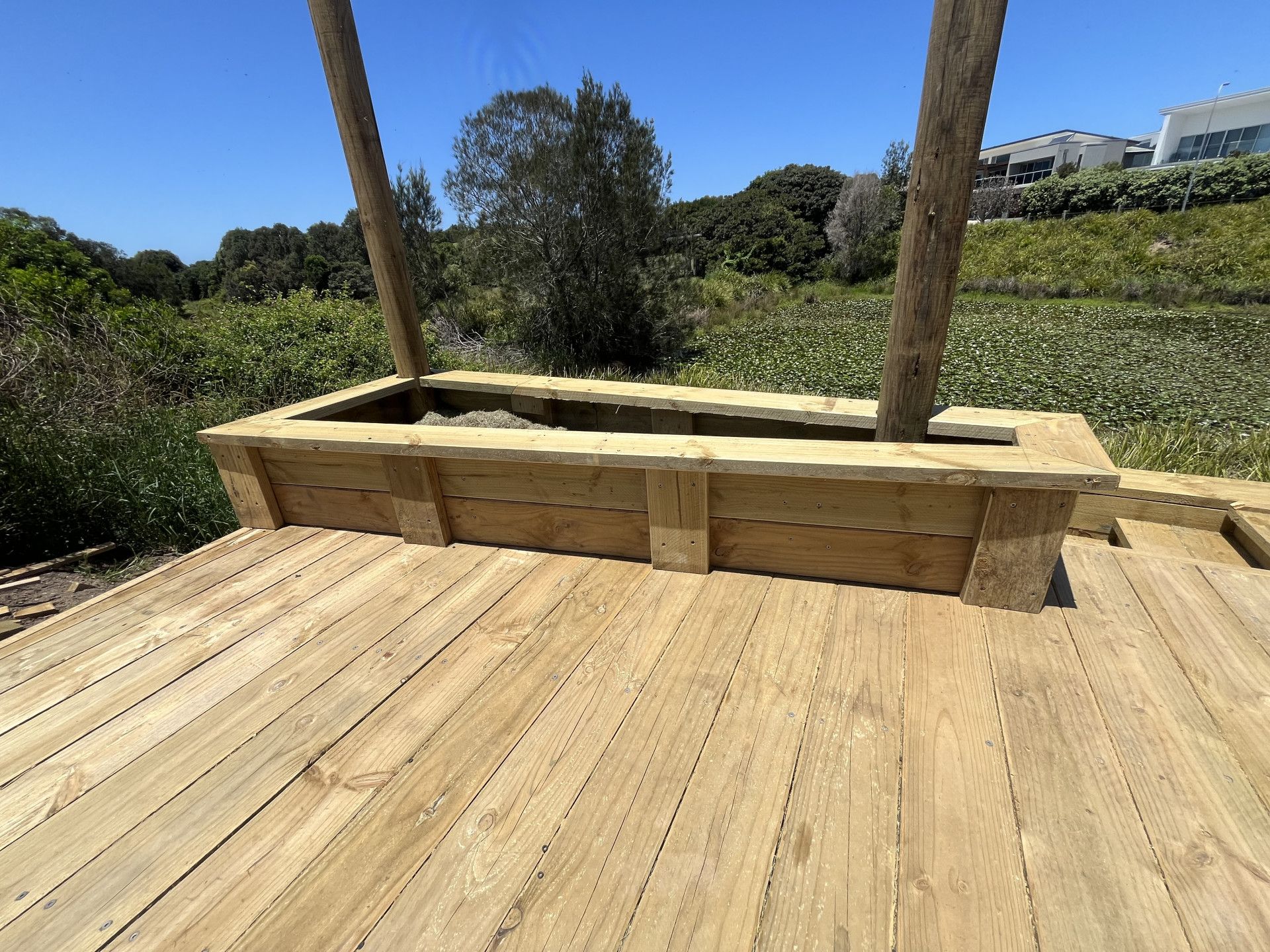 A Set Of Stairs Leading Up To A House With A Wooden Railing — Gnomes Landscape & Garden Supplies In Taree South, NSW