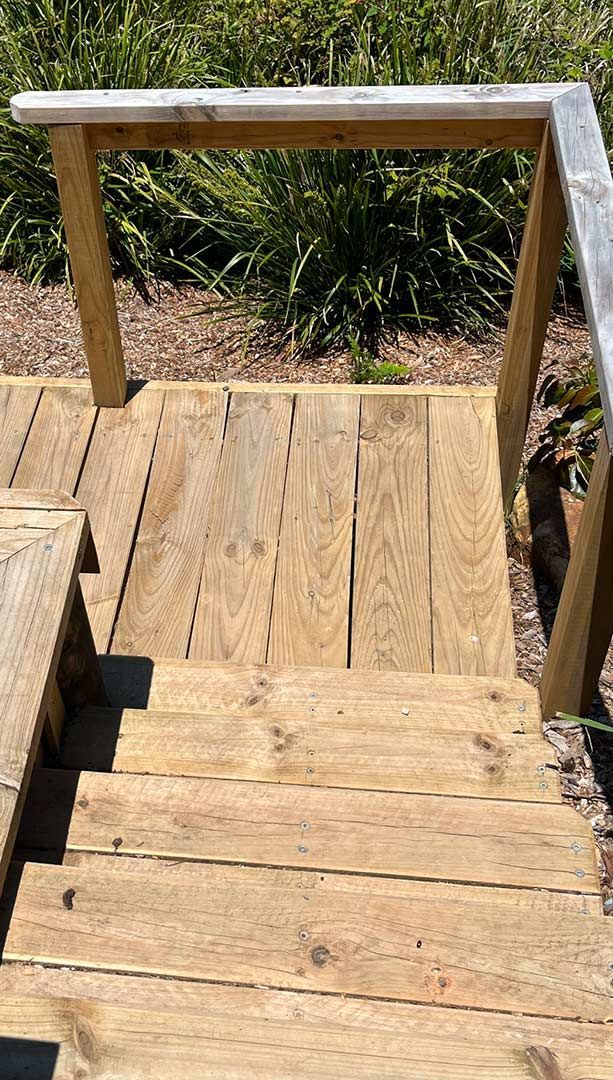 A Close Up Of A Wooden Staircase With A Railing — Gnomes Landscape & Garden Supplies In Port Macquarie, NSW