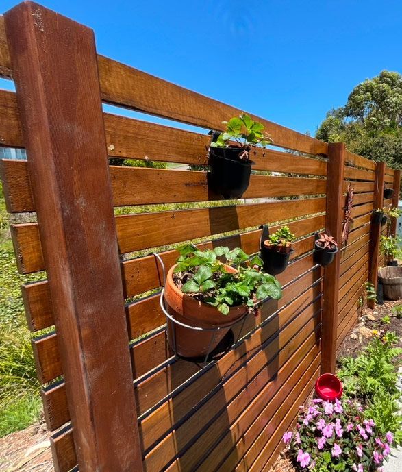 A Close Up Of A Wooden Wall With A Few Holes In It — Gnomes Landscape & Garden Supplies In Old Bar, NSW
