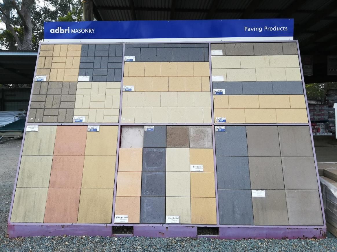 A Display of Bricks and A Sign that Says Paving Projects — Gnomes Landscape & Garden Supplies In Taree South, NSW