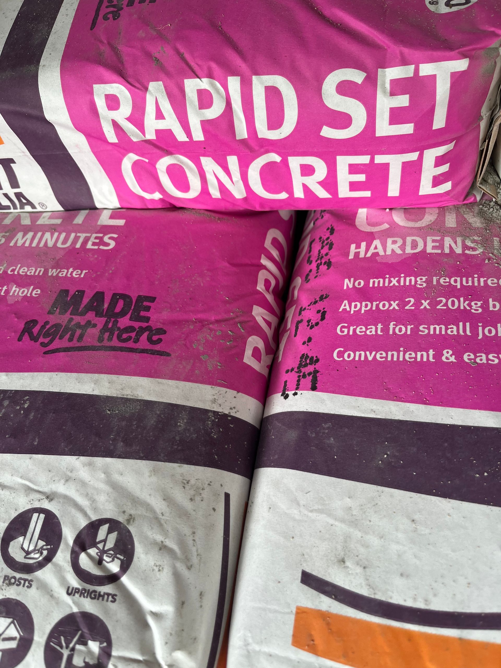 A stack of bags of Rapideset Cement— Gnomes Landscape & Garden Supplies In Taree South, NSW