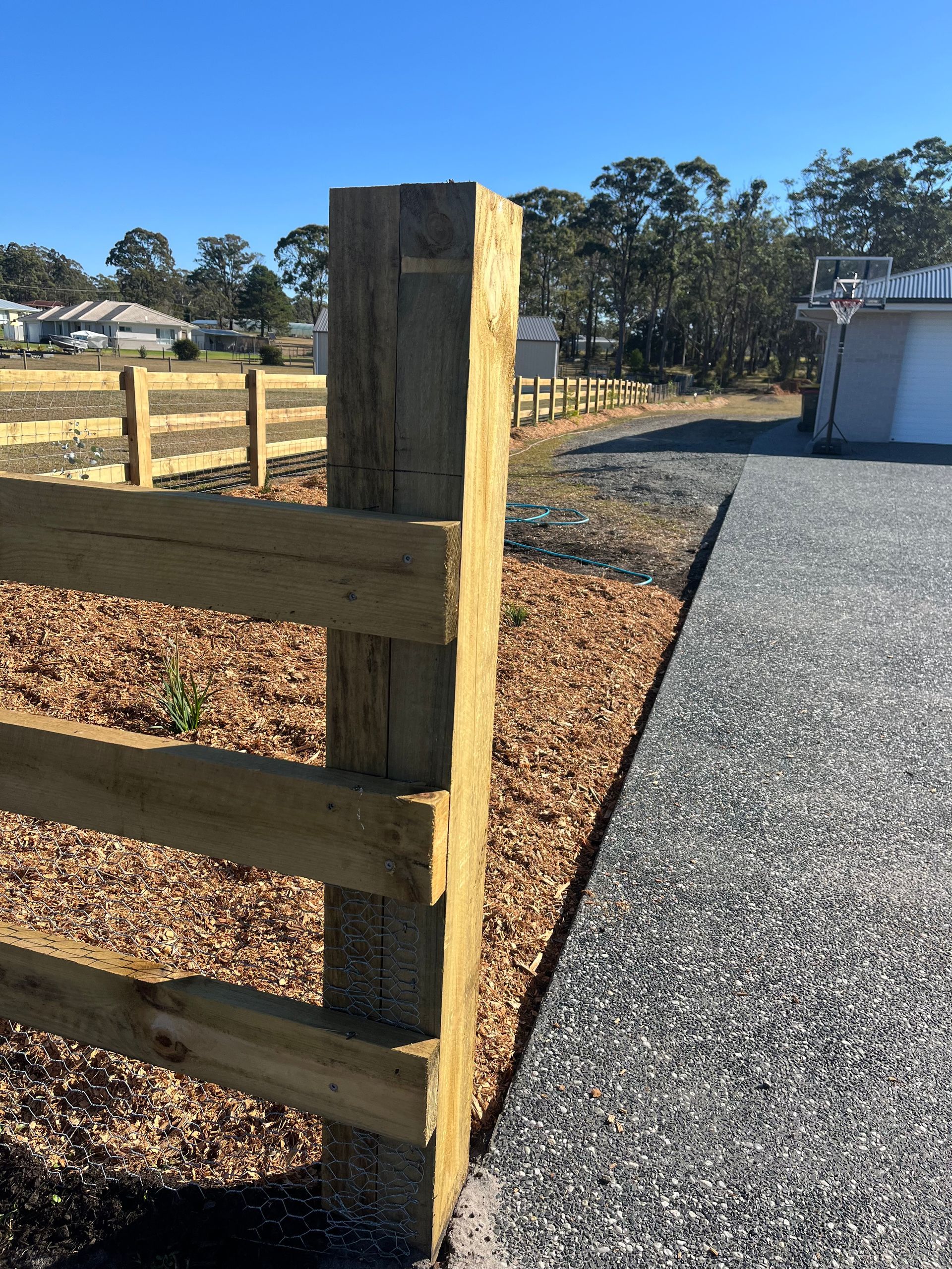 Rural Fencing in front of a home — Gnomes Landscape & Garden Supplies In Taree South, NSW