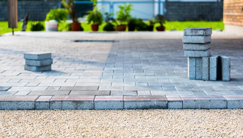 A Brick Walkway Is Being Built in A Backyard — Gnomes Landscape & Garden Supplies In Taree South, NSW