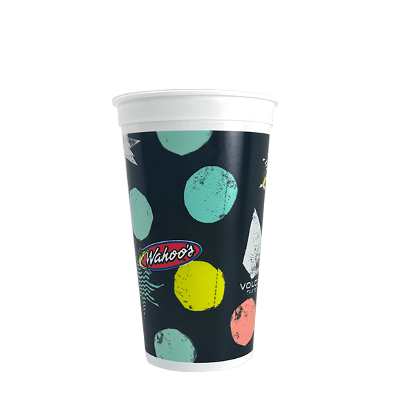 Tall paper cup with teal, yellow, and pink polka dots on a black background, logo for Wahoo's.