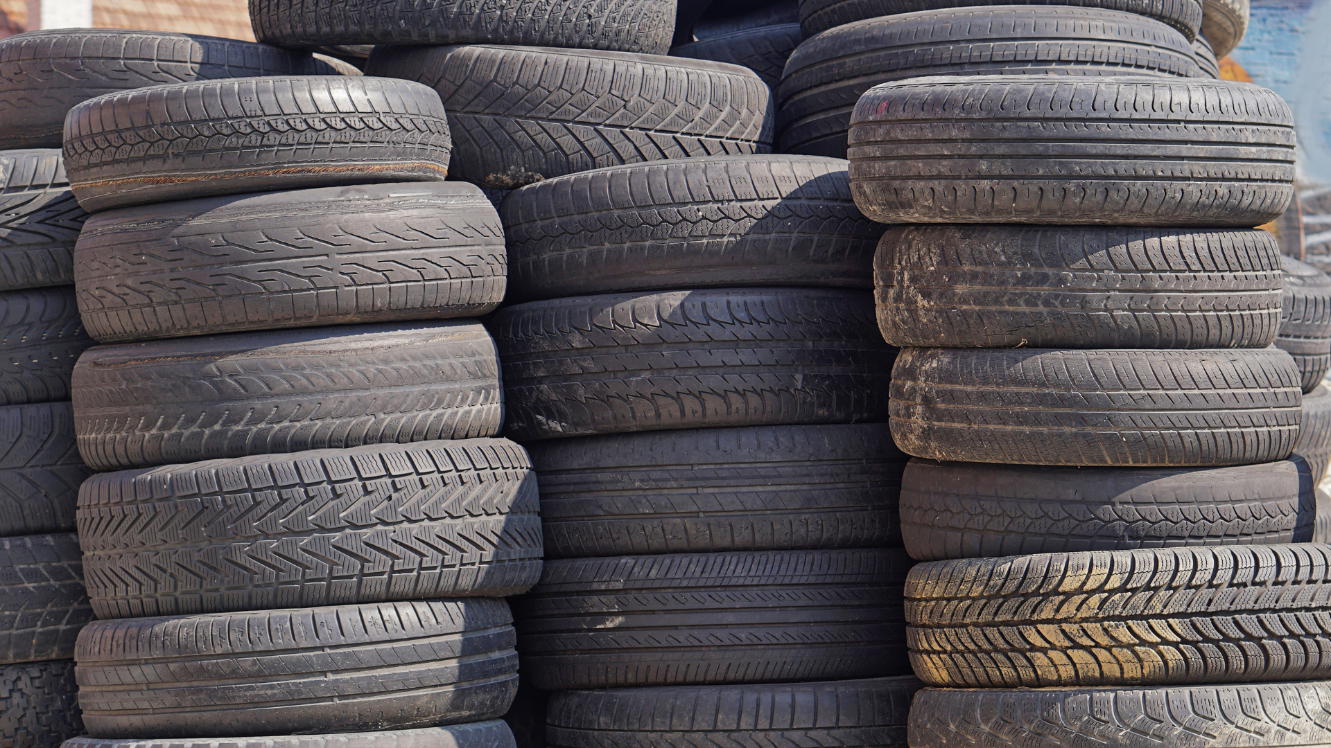 A pile of tires are stacked on top of each other
