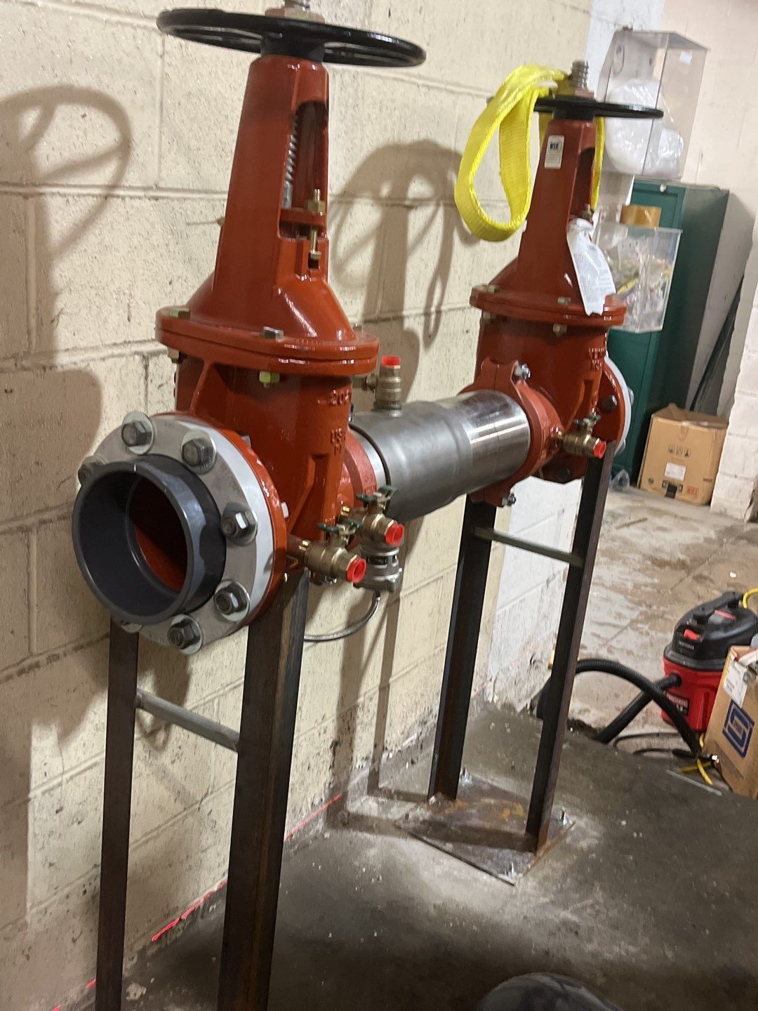 Two valves are sitting next to each other in a room.