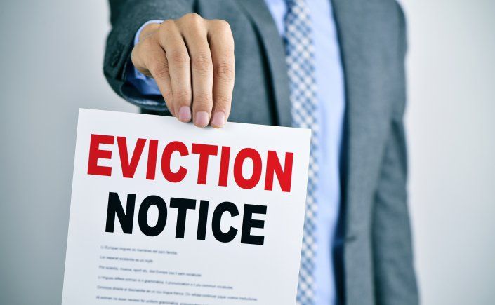 A man hold a Eviction Note