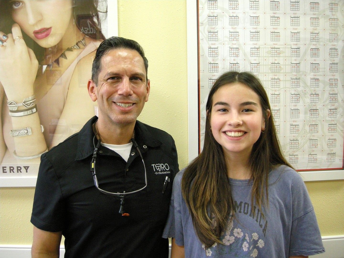 A man and a girl are posing for a picture