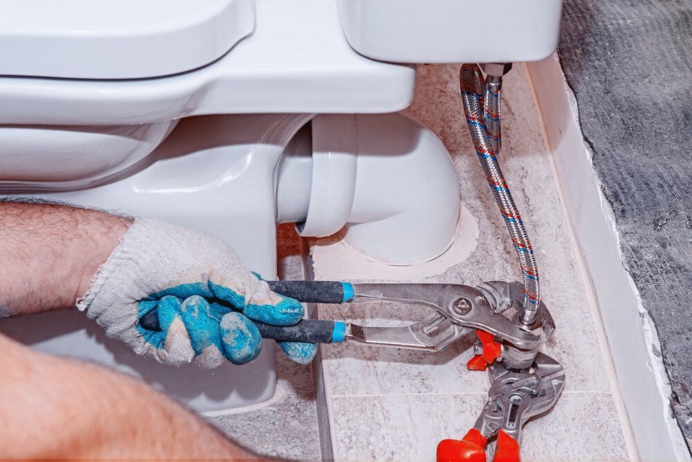 Plumber fixing toilet - Plumber in Port Stephens