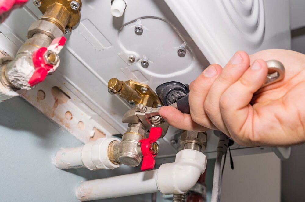 plumber fixing gas fitting - Plumber in Nelson Bay