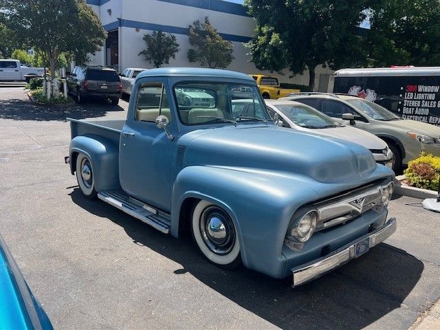 A group of people are sitting on a boat in the water.