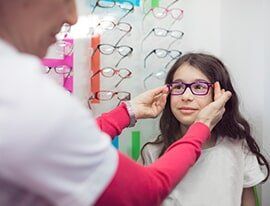 Little Girl Wearing Glasses — Eyeglasses in Corpus Christi, TX Little Girl Wearing Glasses — Eyeglasses in Corpus Christi, TX