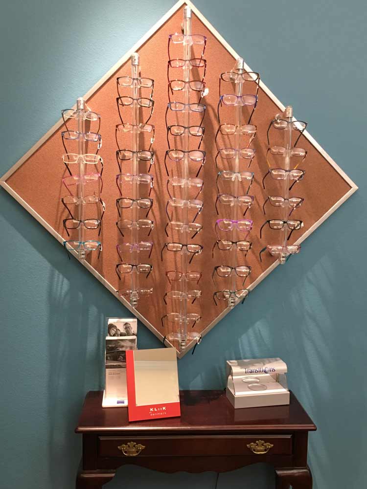 Eye Glasses on a Brown Board — Eyeglasses in Corpus Christi, TX