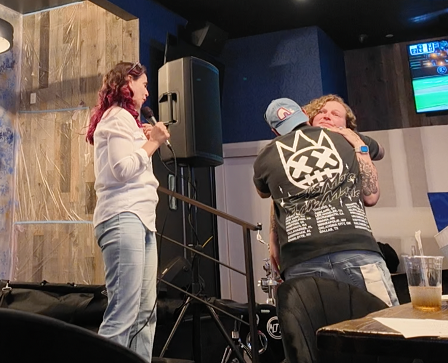 Brain Orlando hugging member of audience 