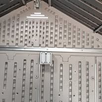 A close up of the inside of a plastic shed.