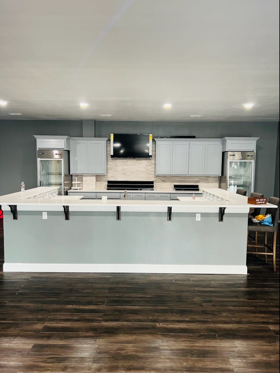A kitchen with a large island in the middle of the room.