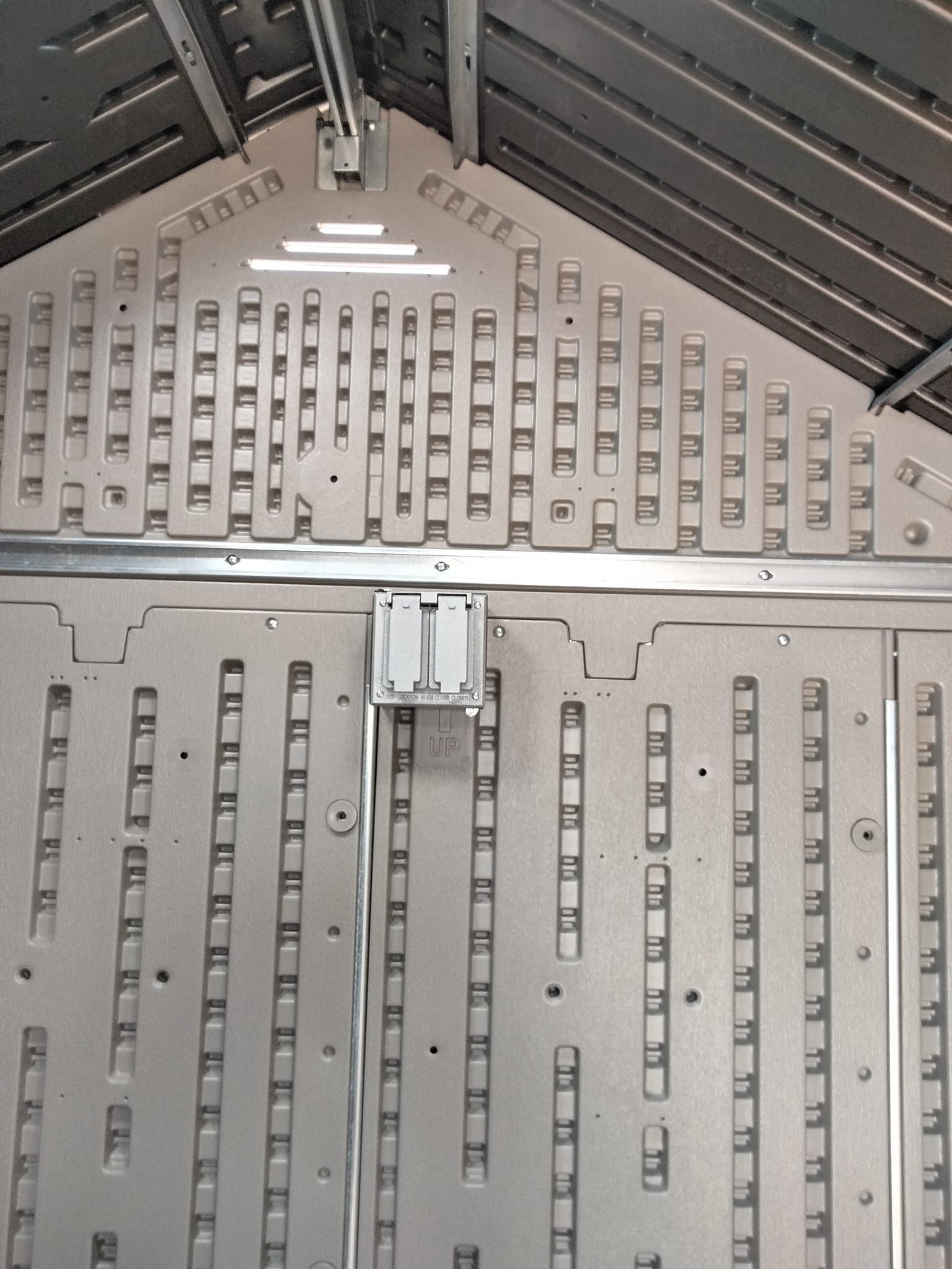 The inside of a shed has a lot of squares on it