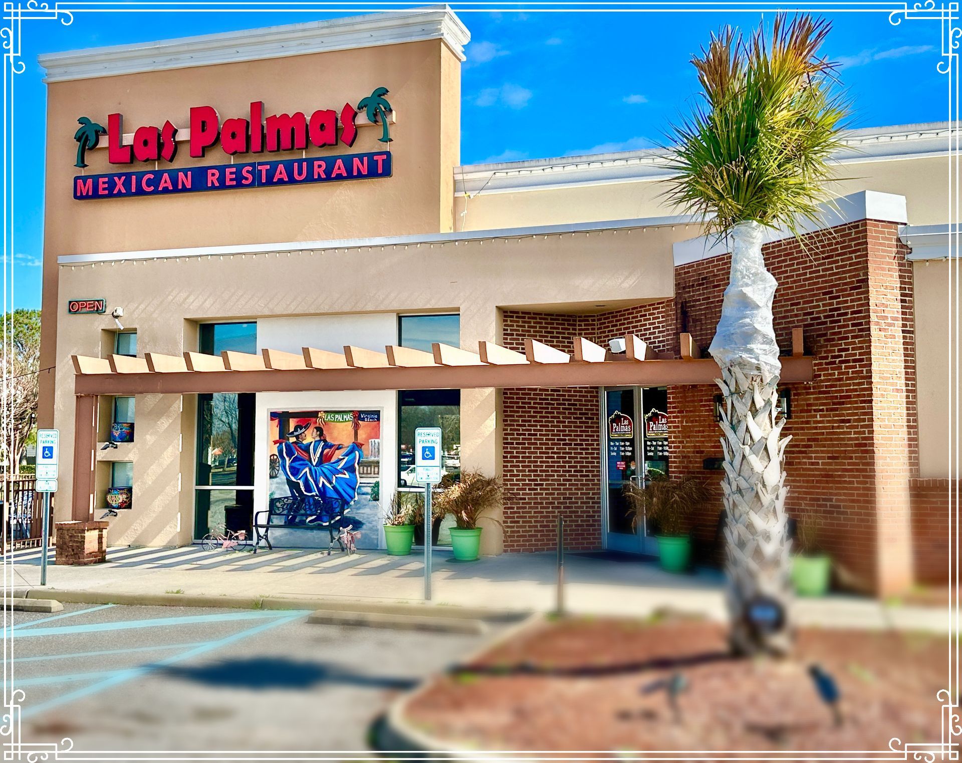 Las Palmas Mexican Restaurant exterior, beige stucco, red signage, palm tree, and wooden pergola.