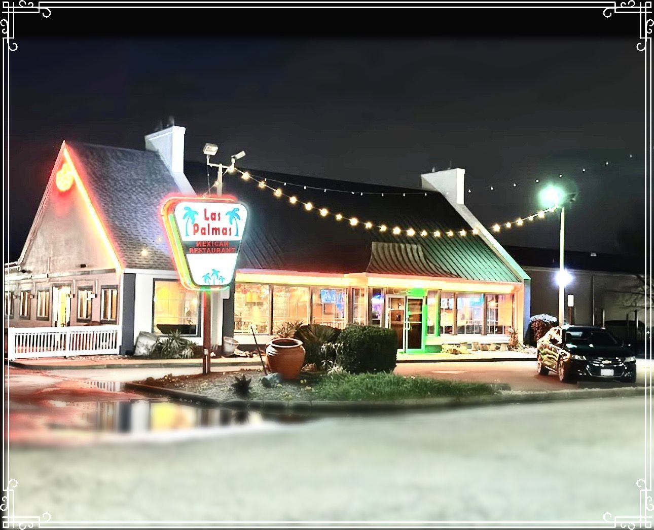 Las Palmas Mexican restaurant at night, lit neon sign, string lights, and a dark car.