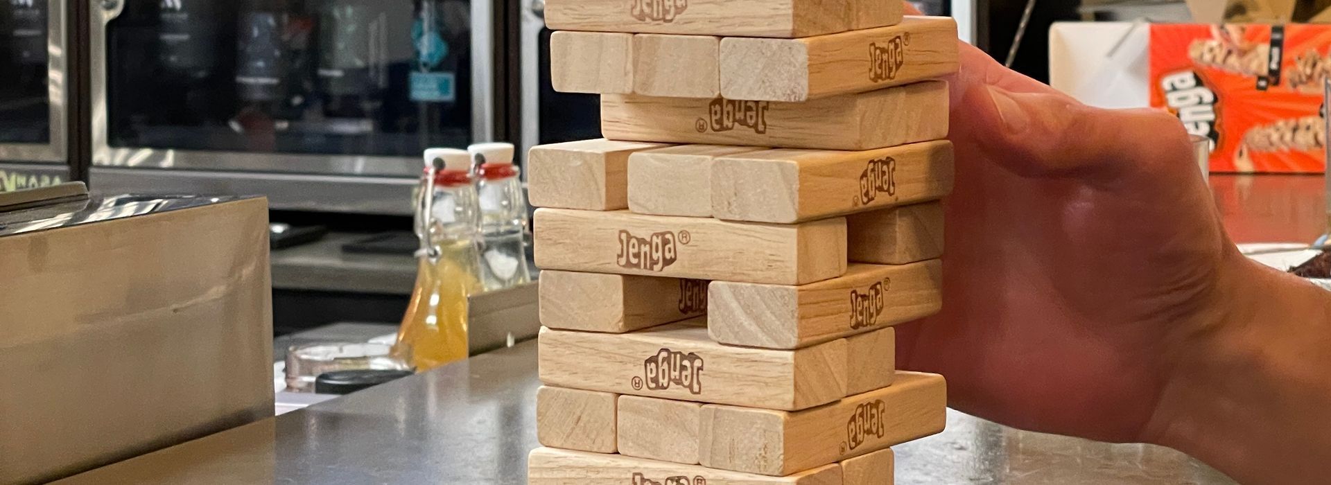 Person holding a green vinyl record, text