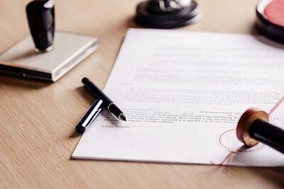 Contract Waiting for a Notary Public Sign on Desk  — Attorney in Miami, FL