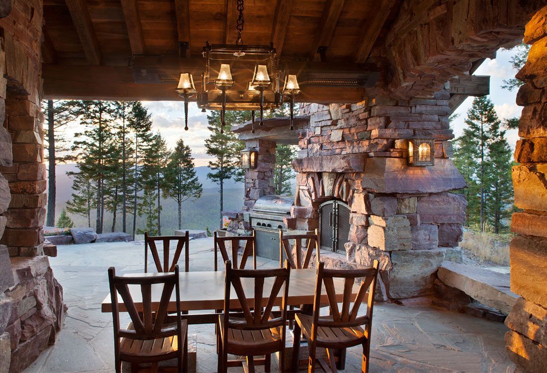 A dining room with a table and chairs and a chandelier.