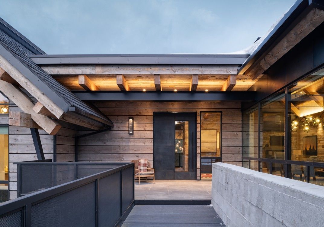 A modern house with a walkway leading to the front door