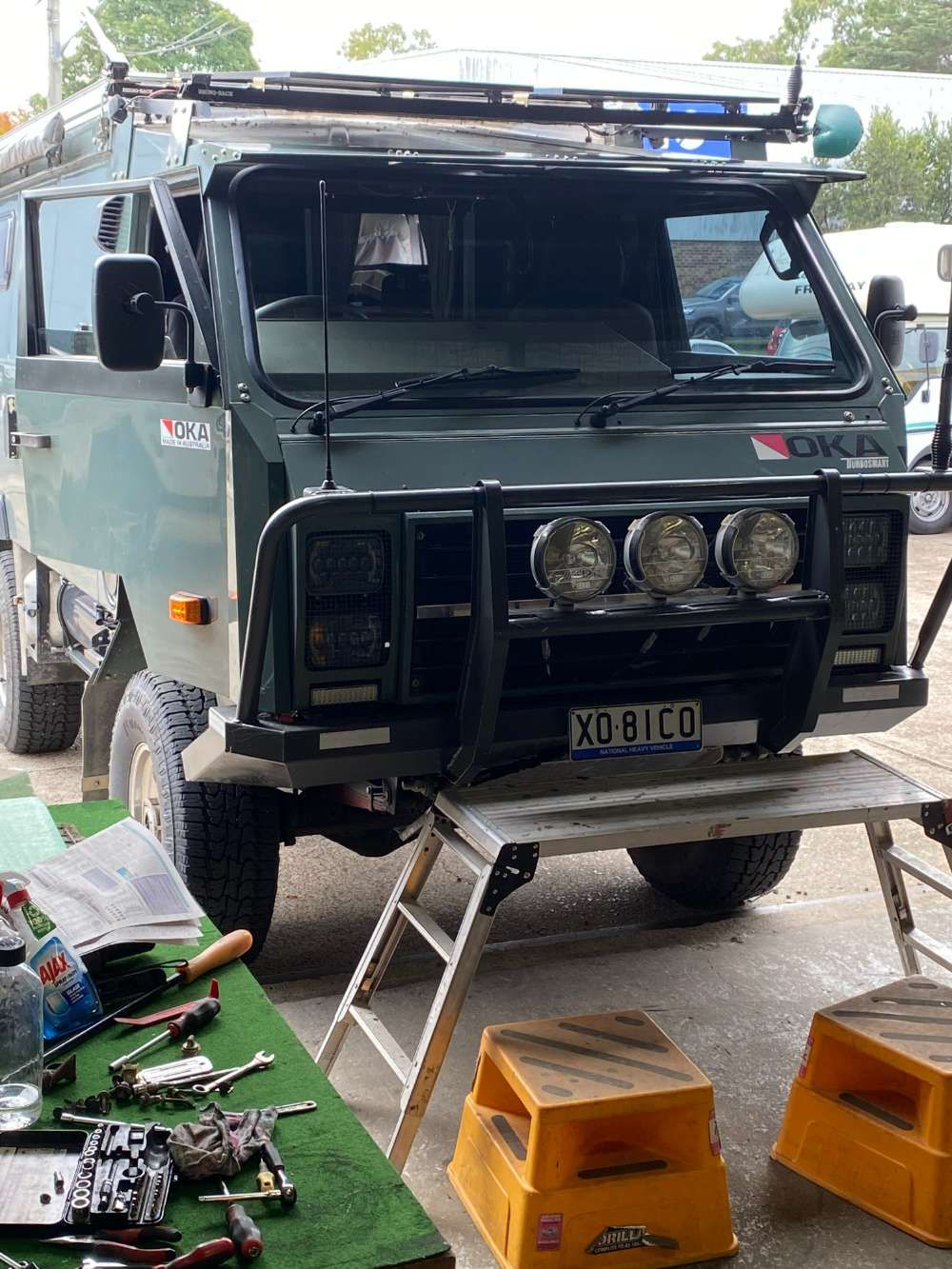 A Truck With A License Plate That Says X01 Co Is Sitting On A Table — Eurobodalla Windscreens in Moruya, NSW