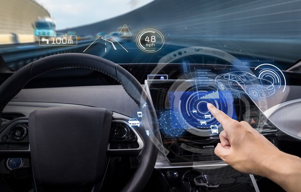 A Person Is Using A Futuristic Steering Wheel In A Car — Eurobodalla Windscreens in Moruya, NSW