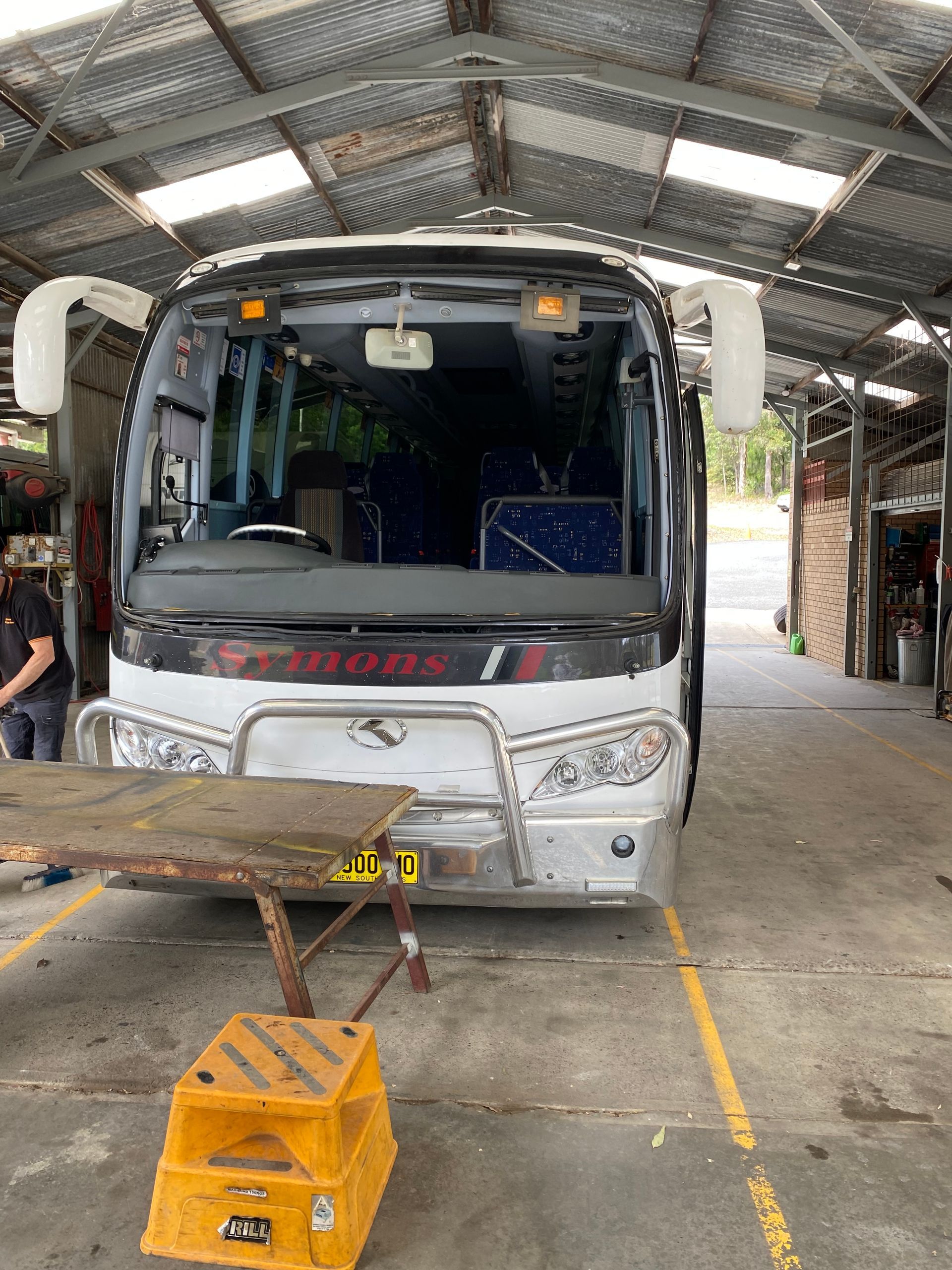 A Bus In A Garage With New Windscreens — Eurobodalla Windscreens in Moruya, NSW