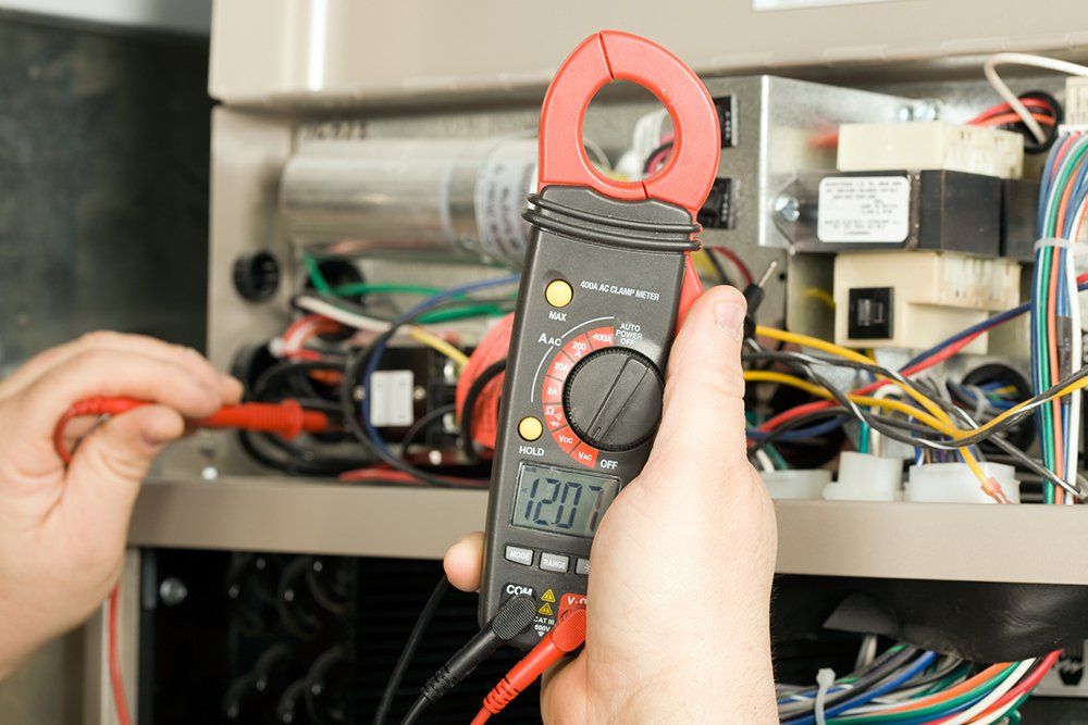 Repairman Checks Voltage | Holmen, WI | Stetter Electric