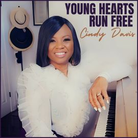 Young hearts run free by cindy davis shows a woman sitting at a piano