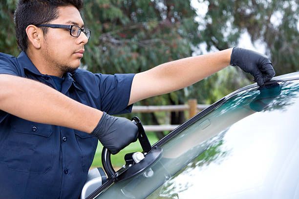Auto glass technician installing a windshield