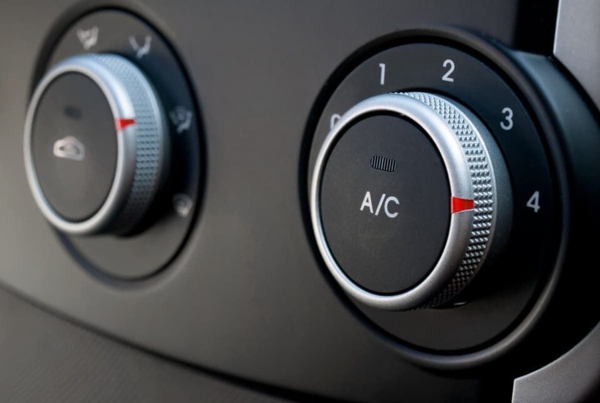 A Close Up Of Two A/c Knobs On A Car — Bartons Auto Air Conditioning In Tolga, QLD