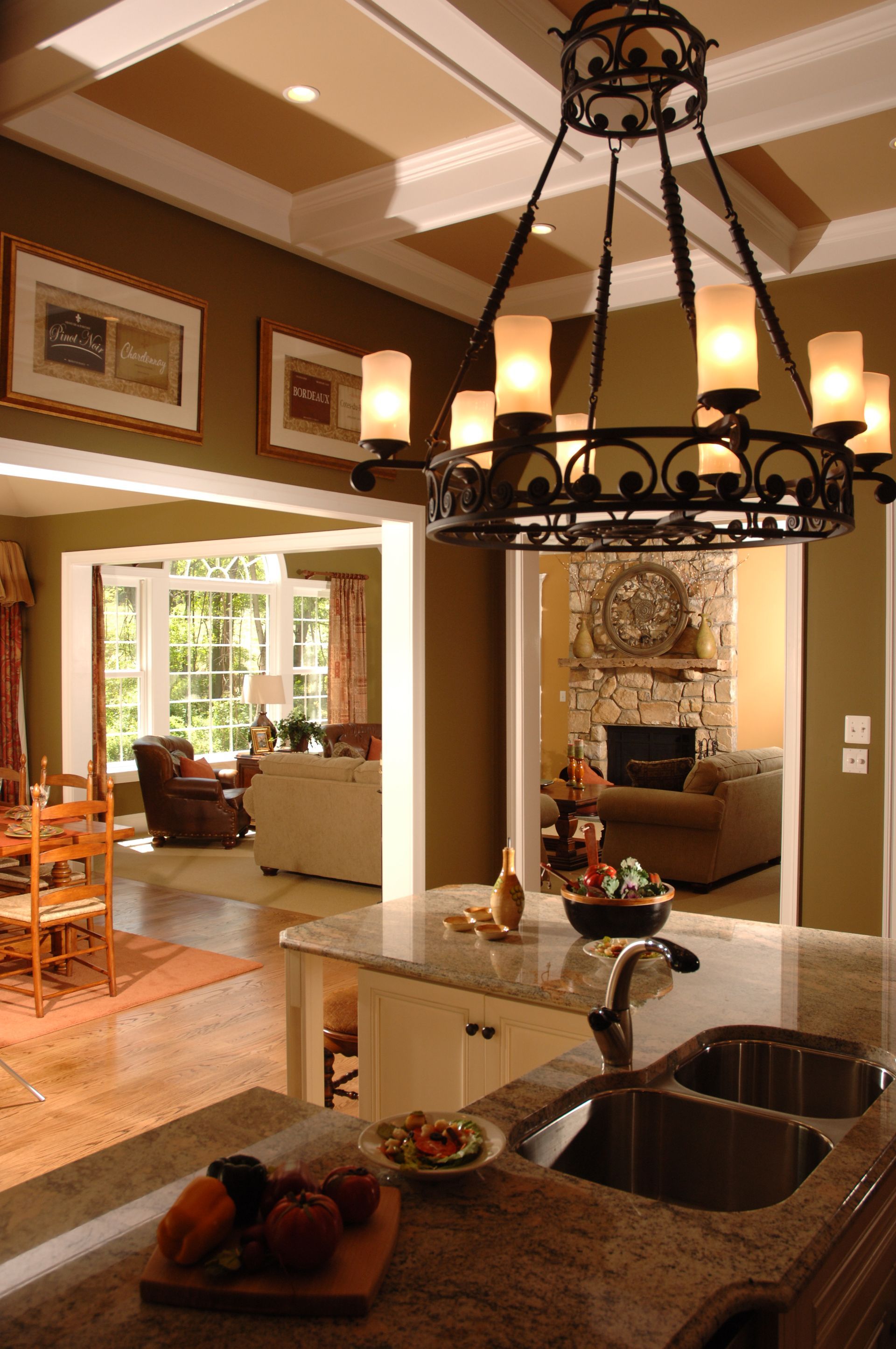 A kitchen with a sink and a chandelier hanging from the ceiling