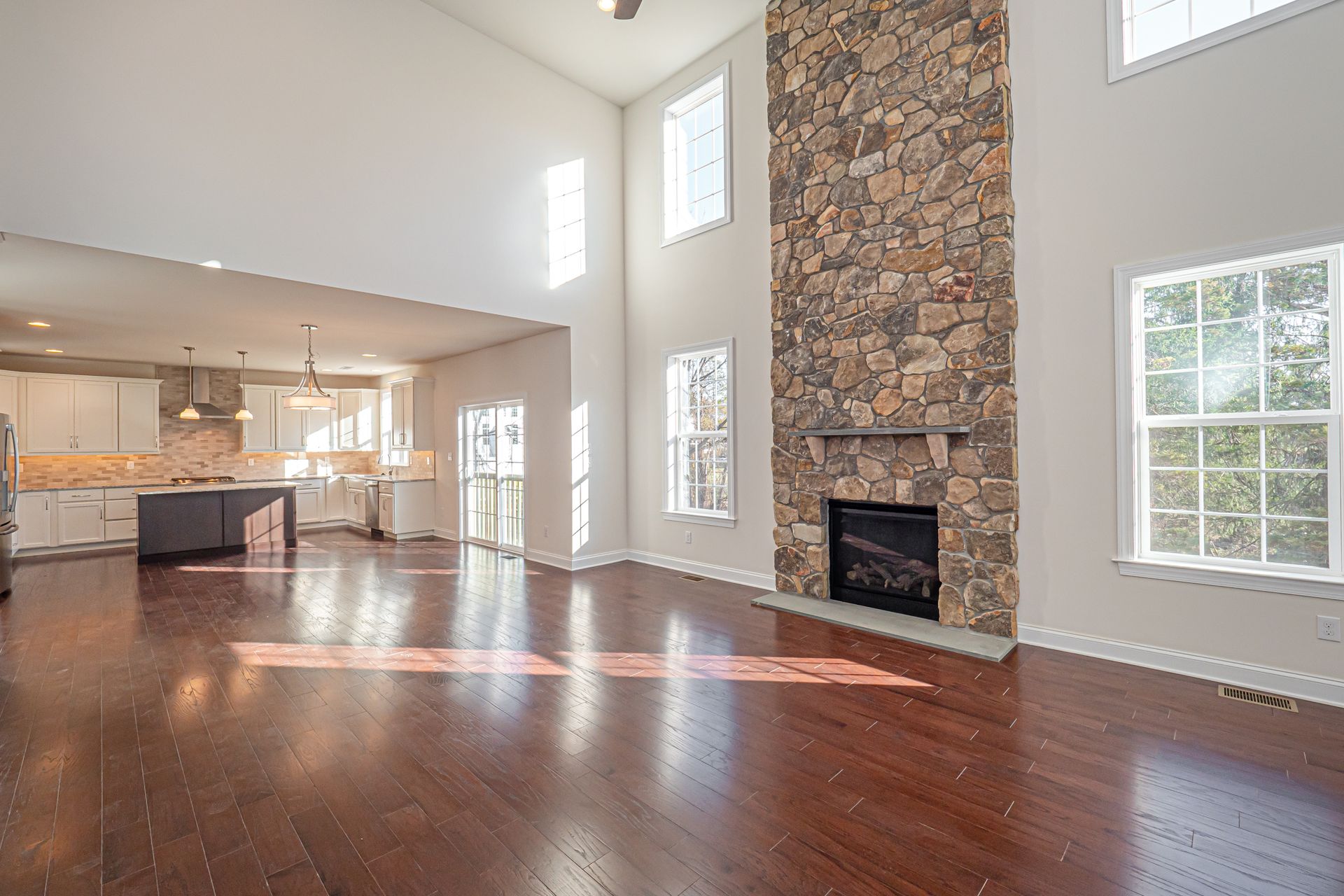 There is a fireplace in the middle of the living room.