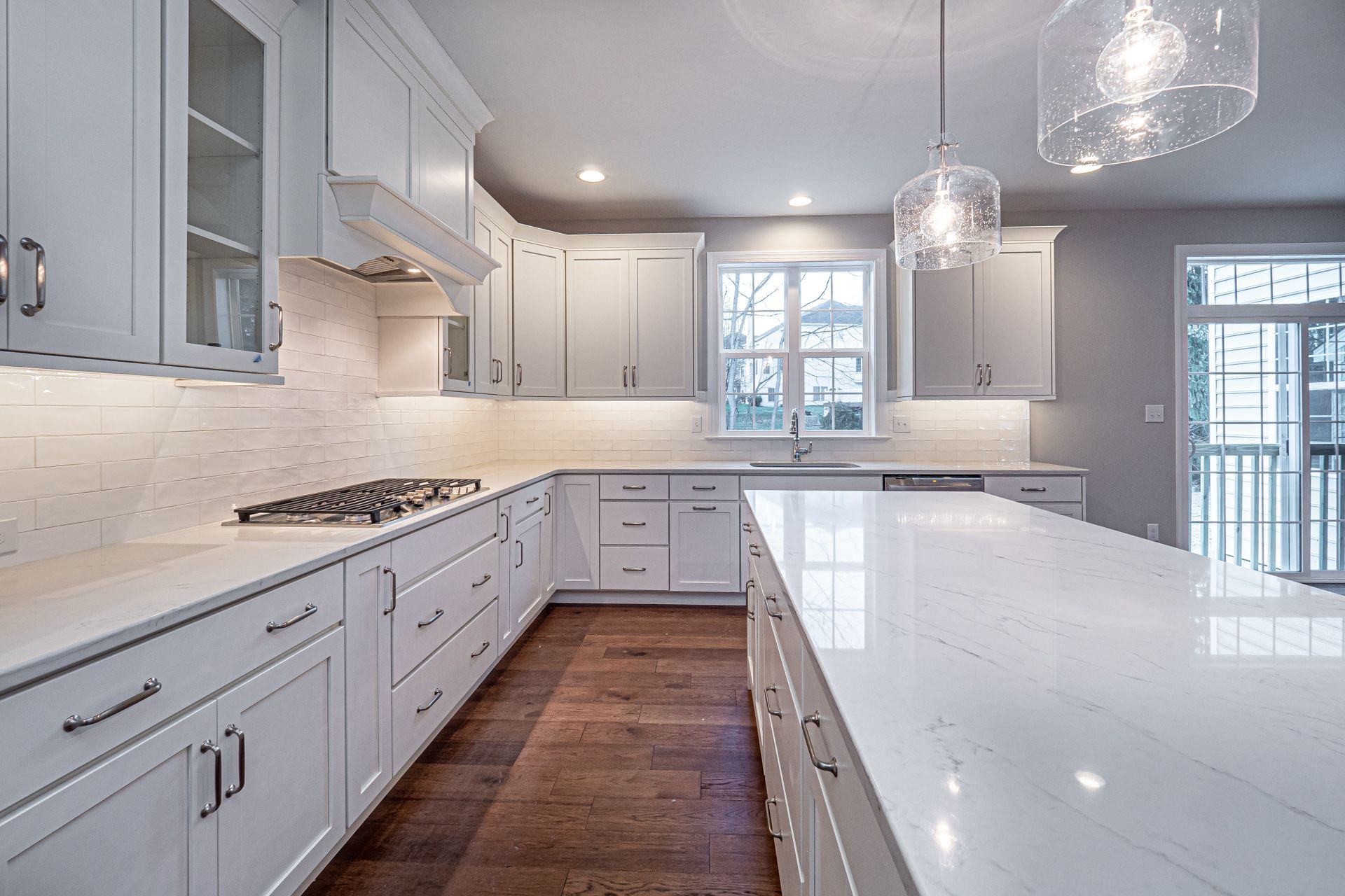 There is a large island in the middle of the kitchen.