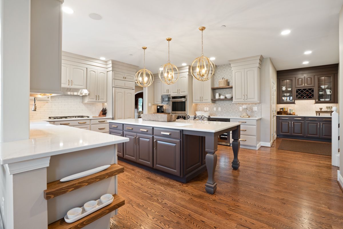 There is a large island in the middle of the kitchen.