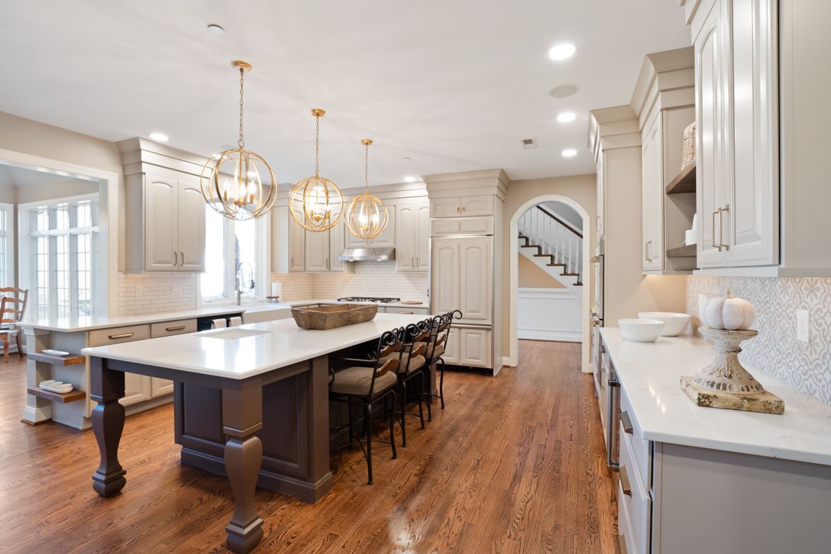There is a large island in the middle of the kitchen.