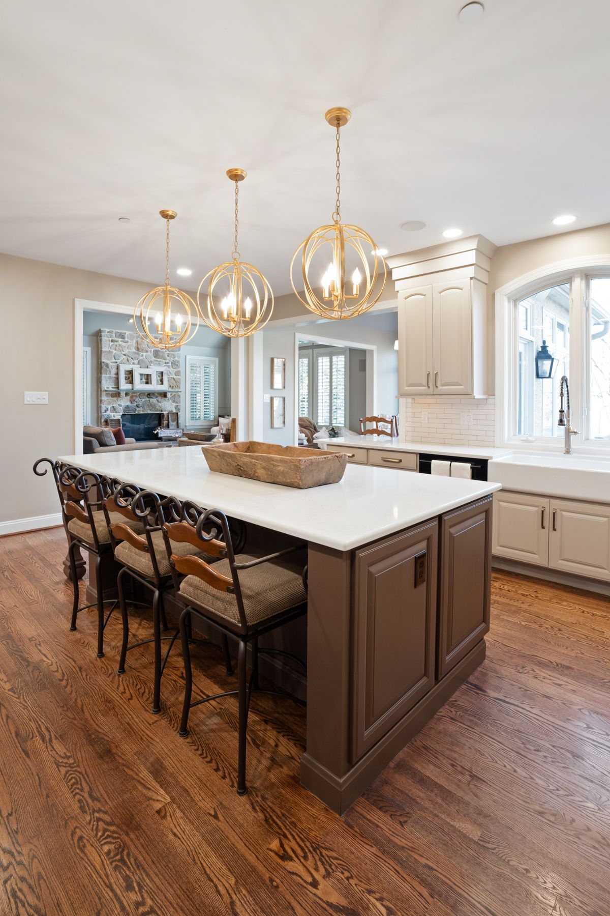 There is a large island in the middle of the kitchen.