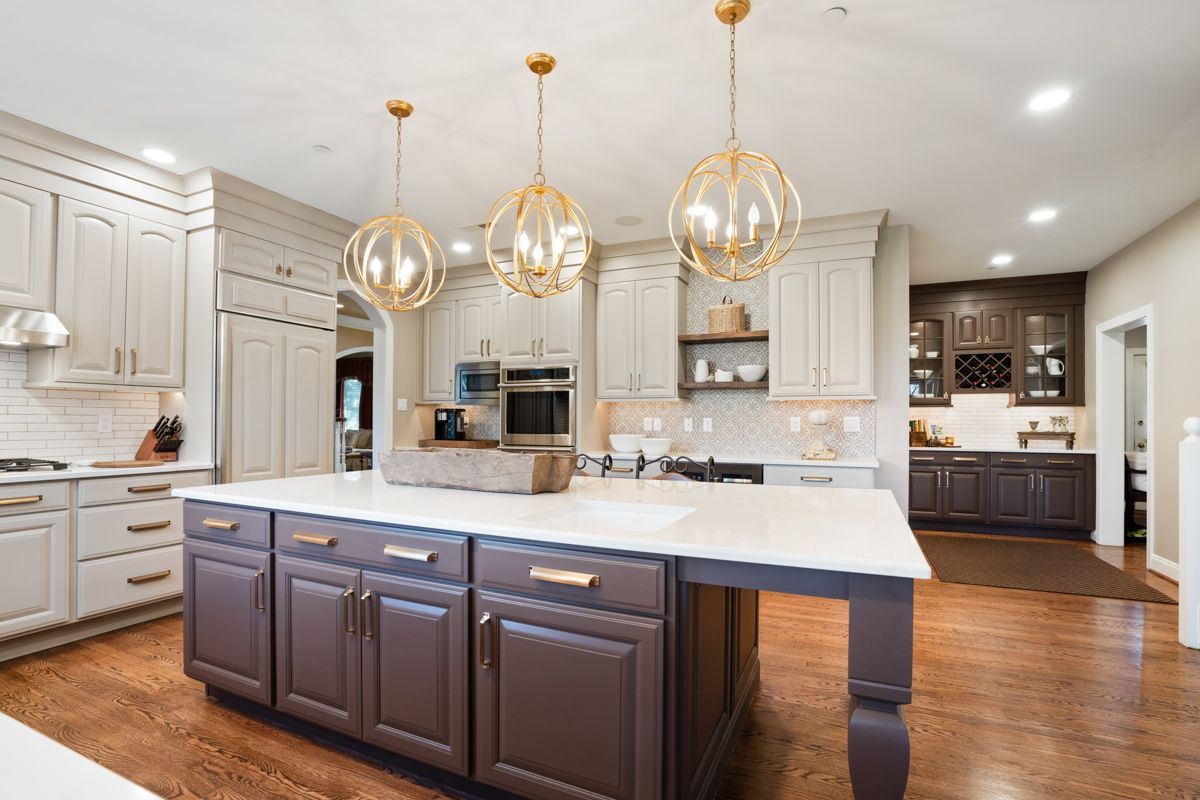 There is a large island in the middle of the kitchen.